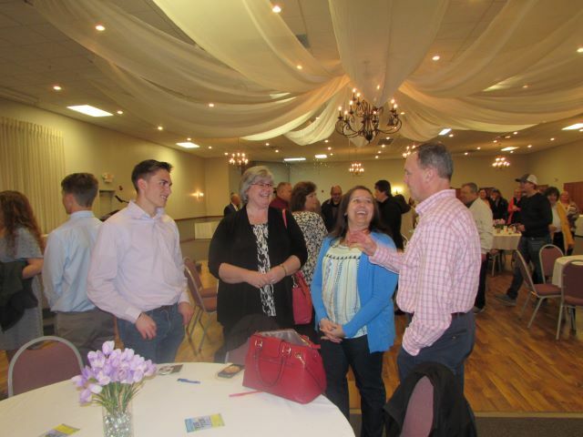 Noah Walters talks with his parents, Tim and Carla Walters and Instructor Lisa Sheppard at the banquet.: Featured Image 1 