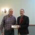 Coldwater Young Farmer, Dusty Uhlenhake, accepting an award from Director Tim Buschur. 