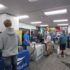 Students visit employer booths at the spring job fair. 